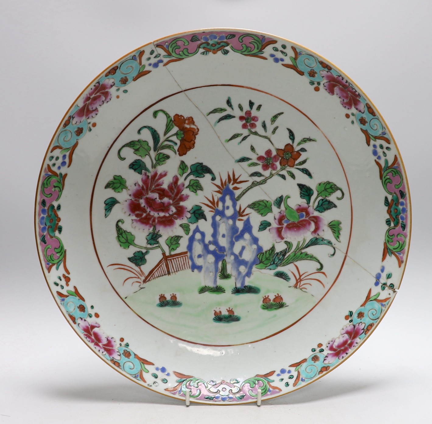 An 18th century Chinese famille rose charger and a Canton plate, charger 36cms